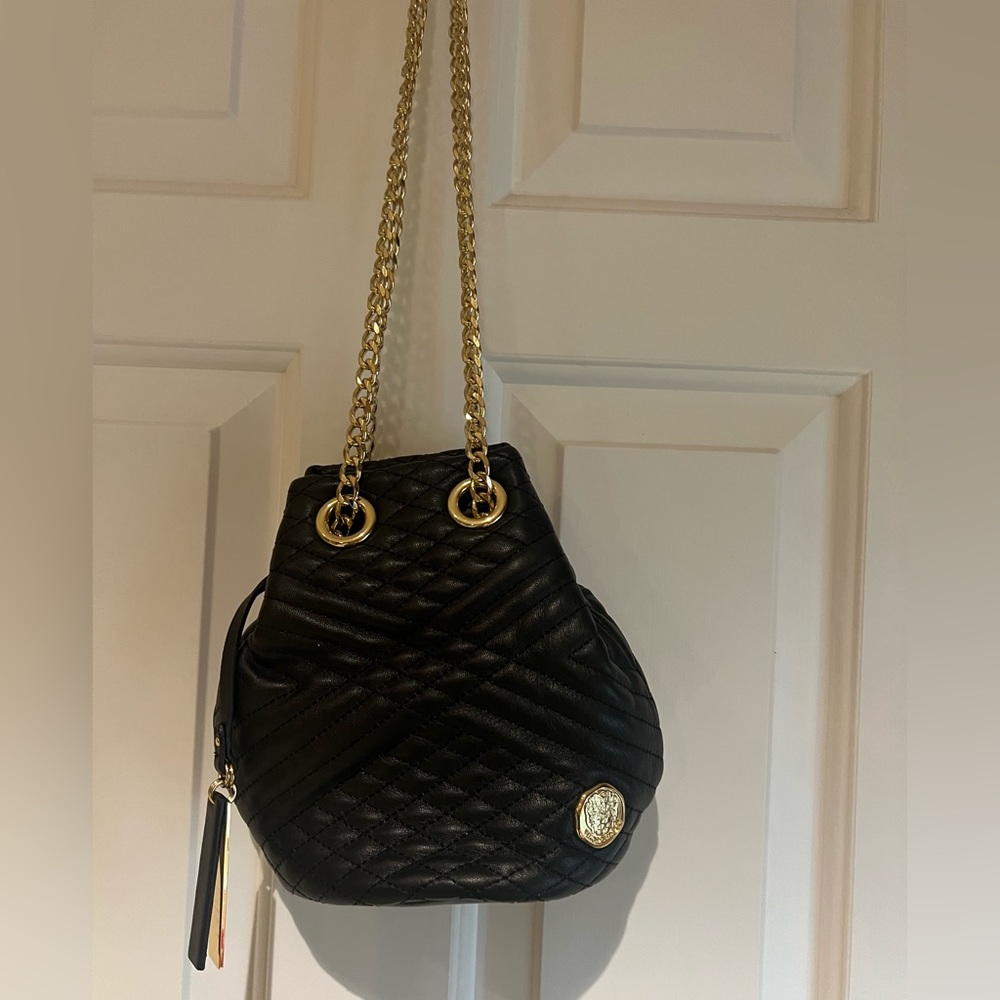 Vince Camuto mini bucket bag on a chain
